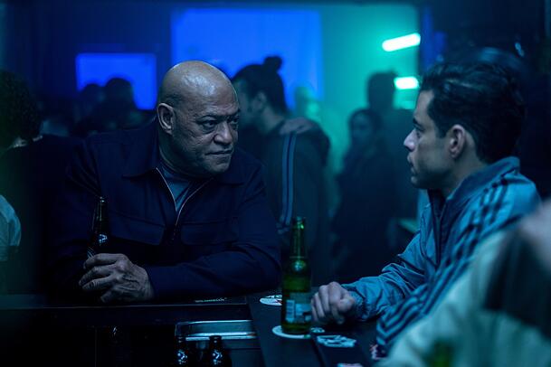 Laurence Fishburne las zwielichtiger Ausbilder und Rami Malek als Heller.