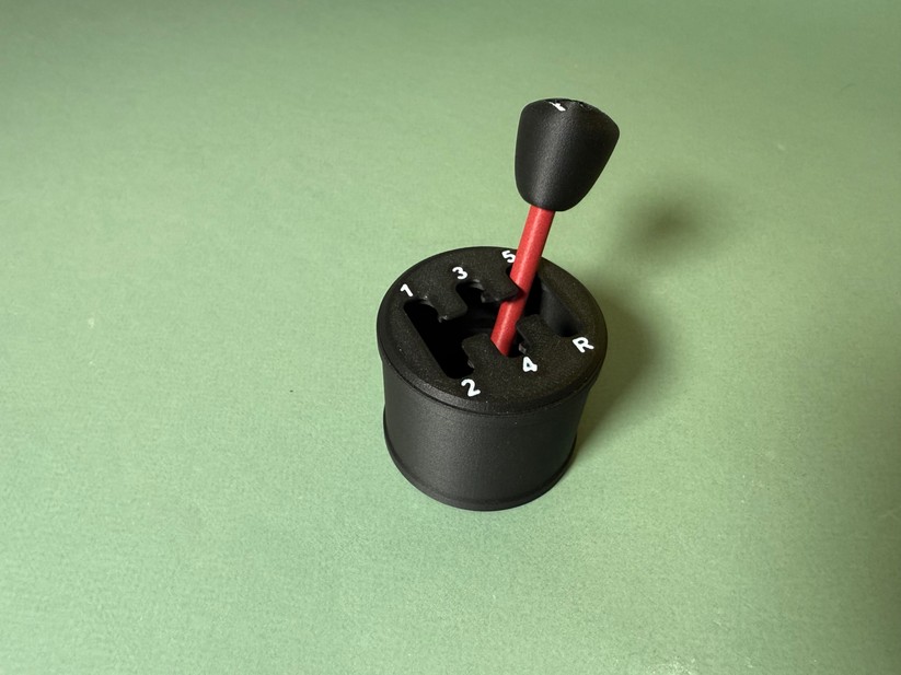 ... weswegen sie unschärfer aussieht als die Zahlen auf diesem Fidget-Schalthebel.