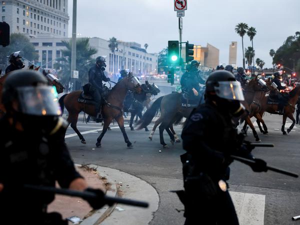 Mounted police officers take position during a protest against federal immigration sweeps in downtown Los Angeles, California, U.S. June 8, 2025. REUTERS/David Swanson