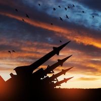 The missiles are aimed at the sky at sunset. Nuclear bomb, chemical weapons, missile defense.