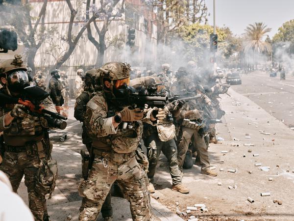 LOS ANGELES, CALIFORNIA - JUNE 7: Protests and confrontations between immigration rights supporters and law enforcement are seen taking place in Paramount, California, and downtown Los Angeles, California, United States on June 7, 2025, following recent raids by Immigration and Customs Enforcement (ICE) and Department of Homeland Security (DHS) agents. Demonstrators are seen using blockades and facing tear gas, flash bang grenades, and pepper ball shots, as rising tensions lead to damaged property across the affected areas. (Photo by Taurat Hossain/Anadolu via Getty Images)