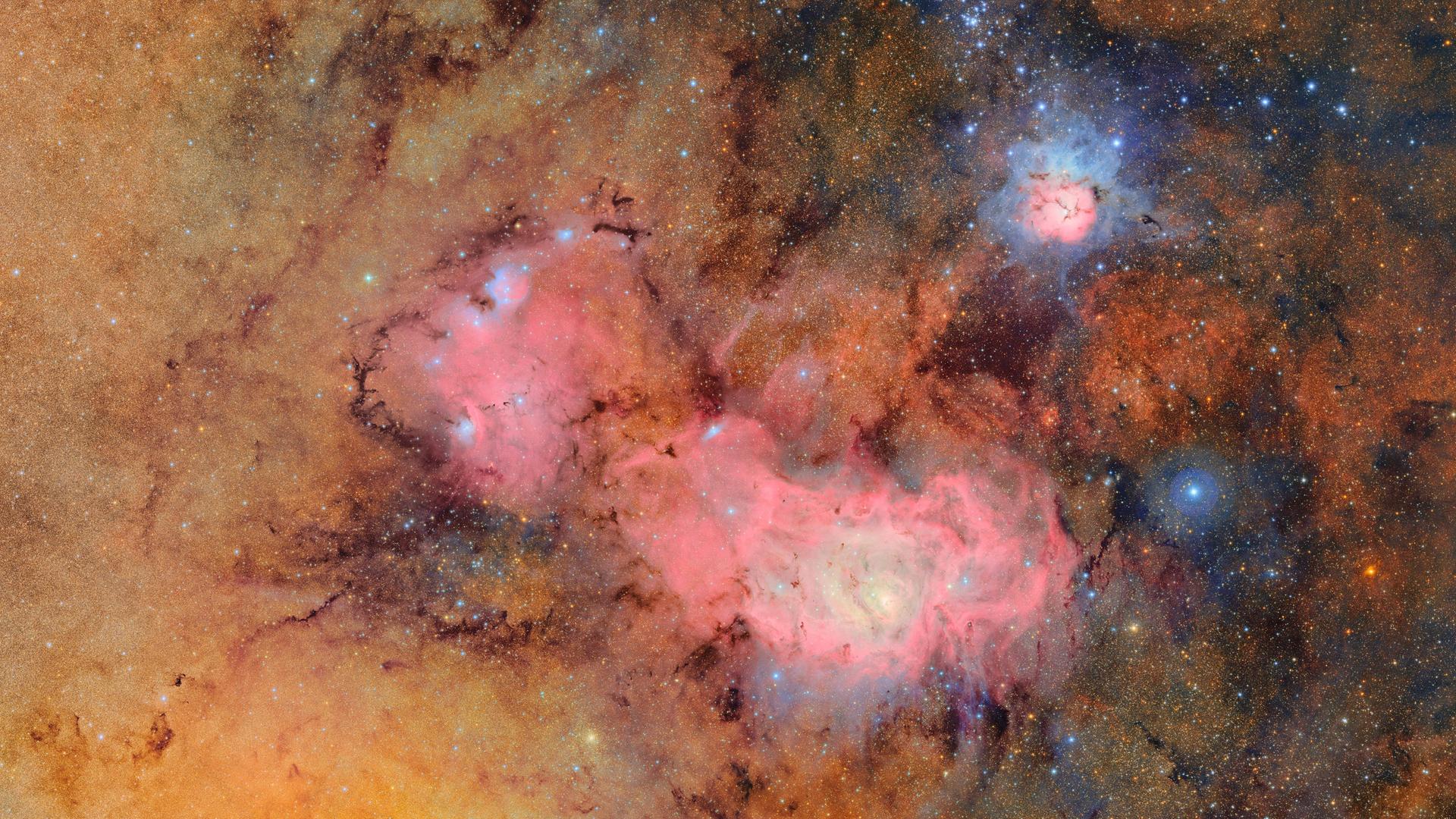 Dieses vom NSF-DOE Vera C. Rubin Observatory zur Verfügung gestellten Bild setzt sich aus 678 Einzelaufnahmen zusammen und es werden sonst schwache oder unsichtbare Details deutlich sichtbar - etwa die Gas- und Staubwolken, aus denen der Trifidnebel (oben rechts) und der Lagunennebel bestehen.