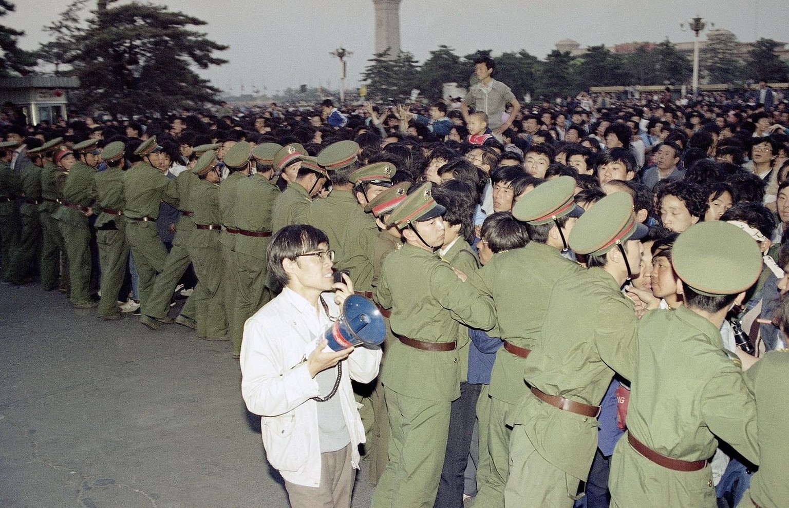 University students push against a police line in Beijing's Tiananmen Square in an attempt to get inside the Great Hall of the people during a banquet there in honor of Soviet Leader Mikhail Gorb ...