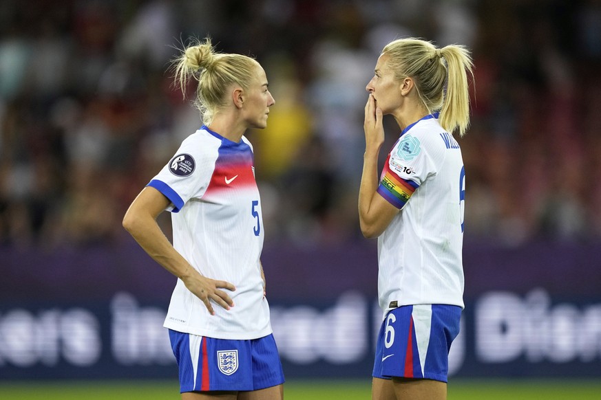 England's Alex Greenwood and Leah Williamson, right, react at the end of the Euro 2025, group D, soccer match between France and England at Stadion Letzigrund in Zurich, Switzerland, Saturday, Ju ...