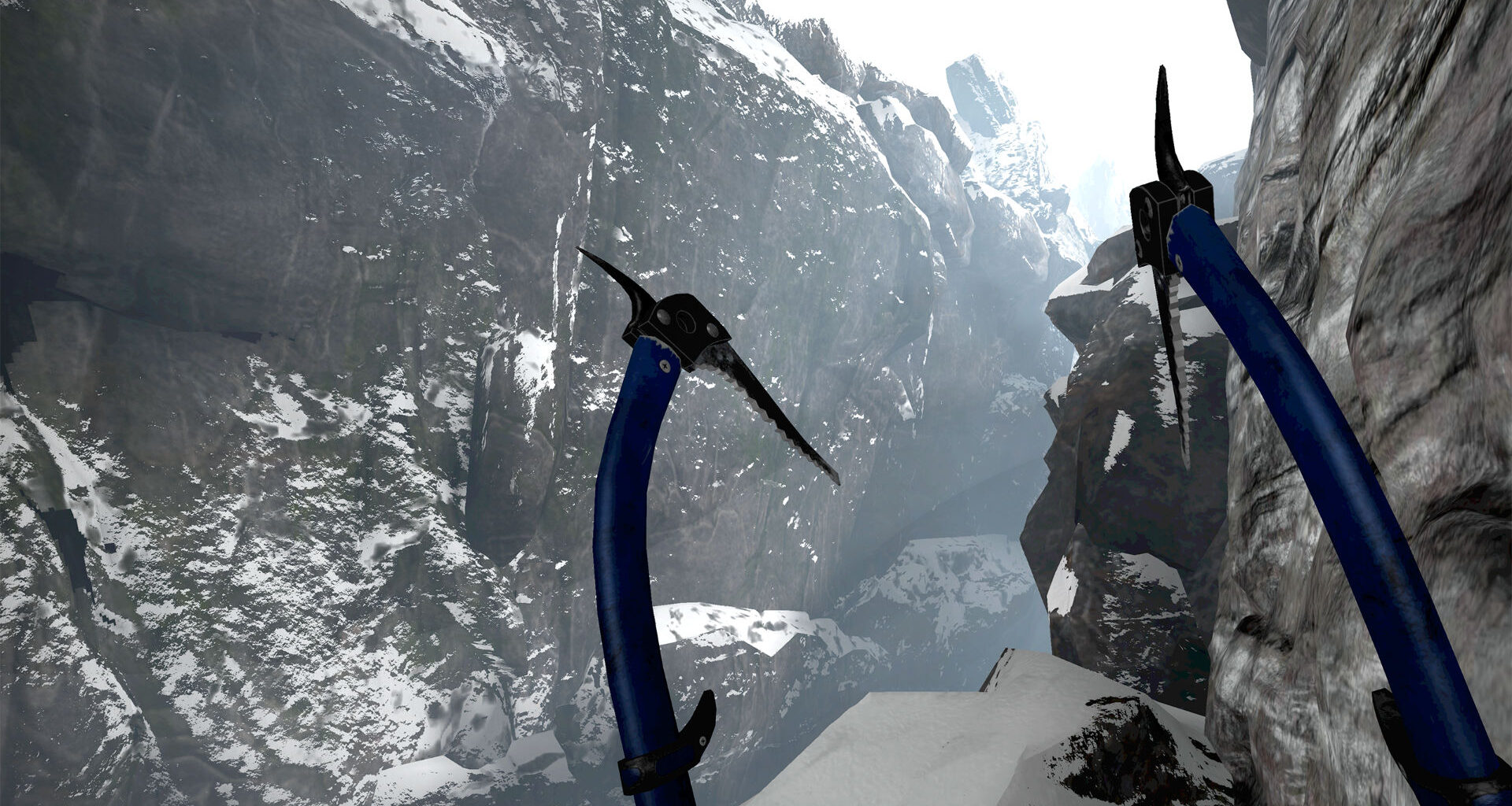 Blick aus der Ich-Perspektive auf zwei blaue Eispickel vor steiler, schneebedeckter Gebirgsschlucht beim Winterbergsteigen.