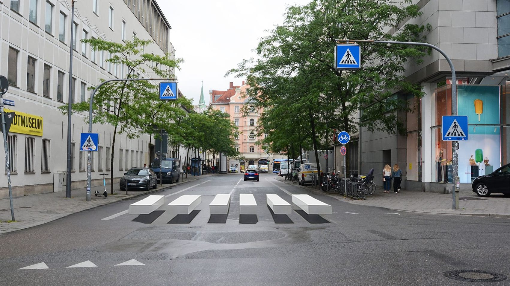 Ein Zebrastreifen mit 3D-Effekt in einer Münchner Straße (Visualisierung): Die optische Täuschung soll Autofahrer zum Abbremsen bringen.