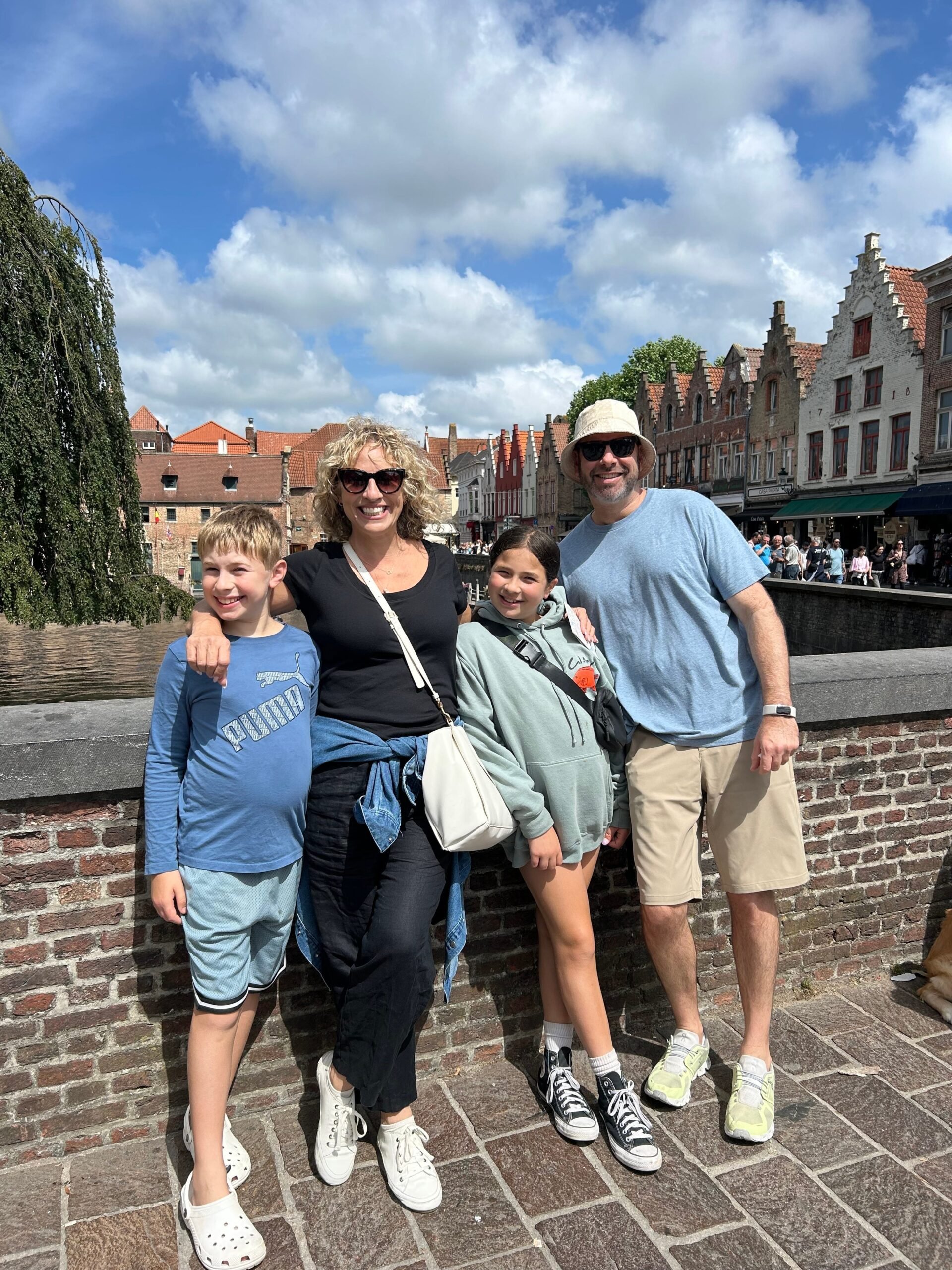 The family in Luxembourg on a bridge over a canal.