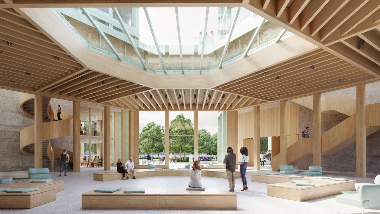 Auf der Visualisierung ist ein großzügiger Raum mit viel Tageslicht und offenen Sitzmöglichkeiten dargestellt.