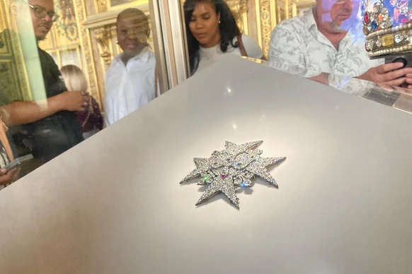 Visitors check jewelry in the Apollo Gallery of the Louvre museum on Sept. 4, 2025 in Paris. (AP Photo/Alexander Turnbull)
France Louvre
