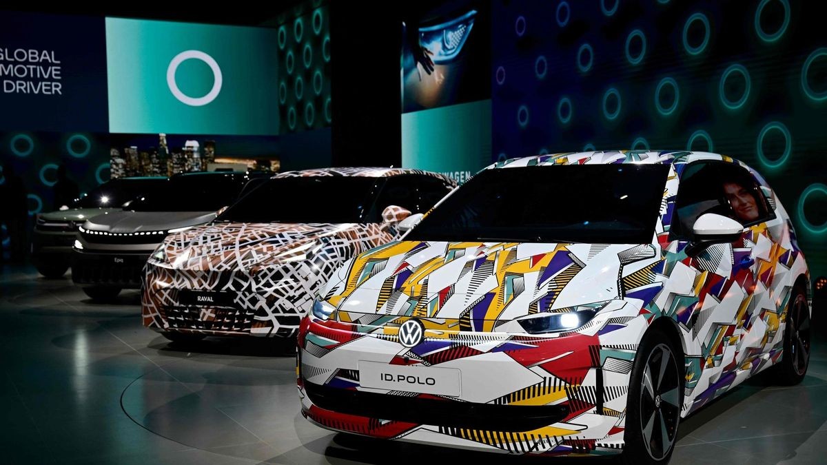 Polo ID cars are pictured at the booth of the German car maker Volkswagen during the International Motor Show IAA on September 8, 2025, in Munich, southern Germany. The IAA Mobility fair runs from September 9 to 14, 2025. (Photo by Tobias SCHWARZ / AFP)