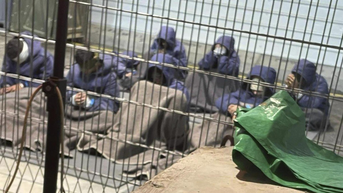 This undated photo from Winter 2023 provided by Breaking The Silence, a whistleblower group of former Israeli soldiers, shows Palestinian prisoners captured in the Gaza Strip by Israeli forces at a detention facility on the Sde Teiman military base in southern Israel. (Breaking The Silence via AP) Israel Palestinians Inside Prison