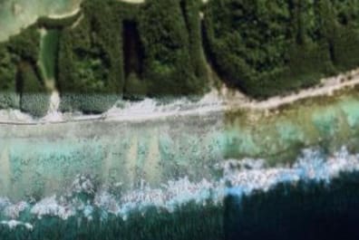 Satelittenbild zeigt den Teil eines Atolls, der verpixelt ist.