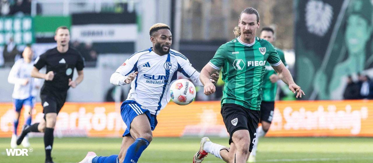 Schalker Moussa Sylla im Zweikampf mit Münsters Jannis Heuer | IMAGO/Beautiful Sports Schalker Moussa Sylla im Zweikampf mit Münsters Jannis Heuer