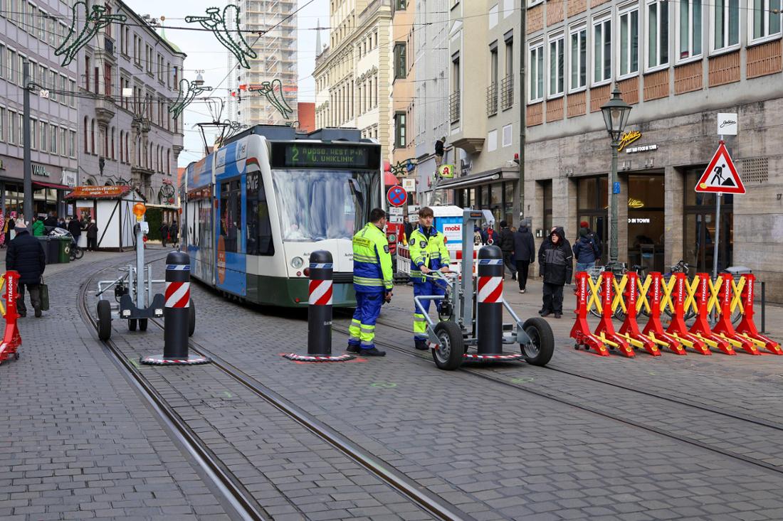 Augsburg, Bavaria, Germany - November 28, 2025: Emergency services are installing mobile security bollards in Augsburg t 