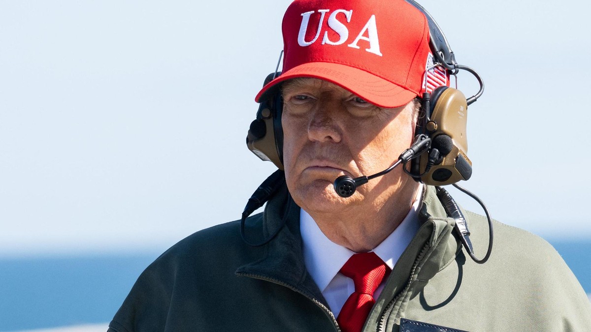 US President Donald Trump visits the USS George H.W. Bush aircraft carrier which is out at sea near Norfolk, Virginia, October 5, 2025, as he travels to see a Naval demonstration as part of the US Navy's 250th anniversary celebration, 