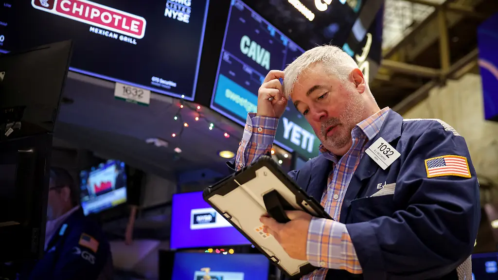 A-trader-works-on-the-floor-at-the-New-York-Stock-Exchange-NYSE-in-New-York-City-U-S-December-15-2025