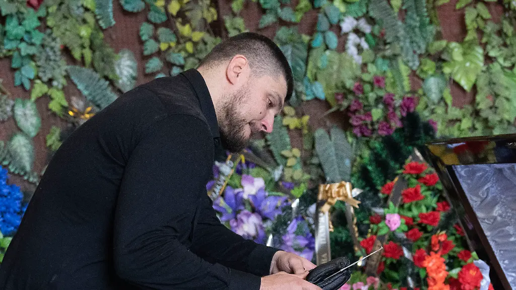 Denis-Kapustin-leader-of-the-Russian-Volunteer-Corps-pays-the-last-respect-to-his-fellow-soldier-Daniil-Maznik-during-a-farewell-ceremony-in-Kyiv-Ukraine-Saturday-June-10-2023-Maznik-was-killed-in-a-battle-with-the-Russian-forces-in-Belgorod-region-Russia-The-Russian-Volunteer-Corps-is-a-paramilitary-unit-of-Russian-citizens-based-in-Ukraine-It-was-formed-in-2022-during-the-first-year-of-the-Russian-invasion-of-Ukraine-to-fight-against-the-regime-of-Vladimir-Putin