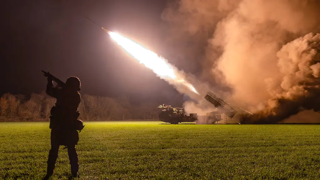RUSSIA-ZAPOROZHYE-REGION-NOVEMBER-13-2025-A-member-of-an-artillery-unit-of-the-Russian-Airborne-Forces-with-the-Dnepr-Group-of-the-Russian-Armed-Forces-is-seen-as-an-Uragan-multiple-rocket-launcher-is-deployed-in-the-zone-of-the-special-military-operation