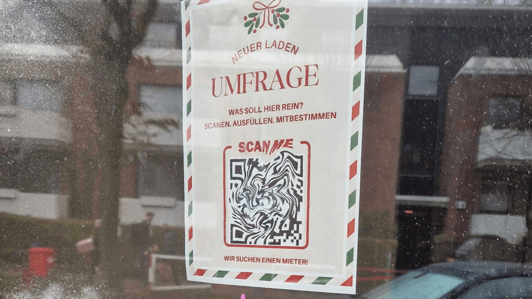 Das Plakat mit QR-Code: Hier sollen Anwohner eine Umfrage ausfüllen, welcher Laden zum Kiez passt.