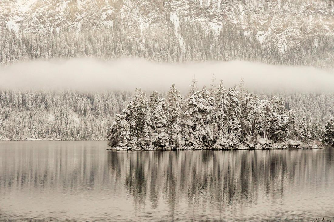 People Hiking Around The Bavarian Alpine Lake Eibsee In Winter 