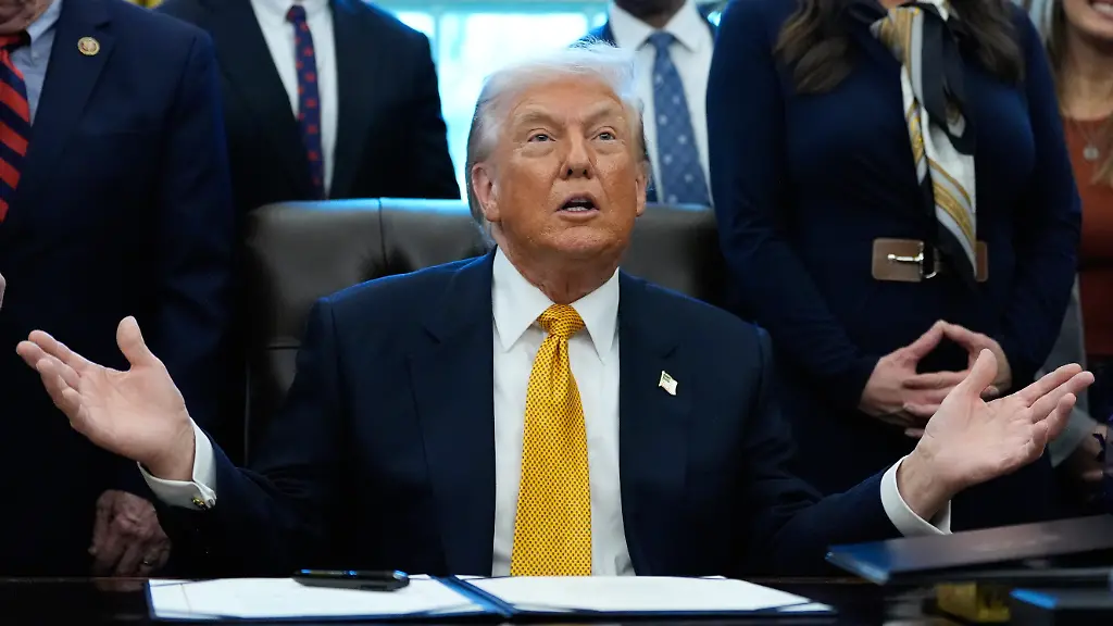 President-Donald-Trump-speaks-in-the-Oval-Office-of-the-White-House-Wednesday-Jan-14-2026-in-Washington-before-signing-a-bill-that-returns-whole-milk-to-school-cafeterias-across-the-country
