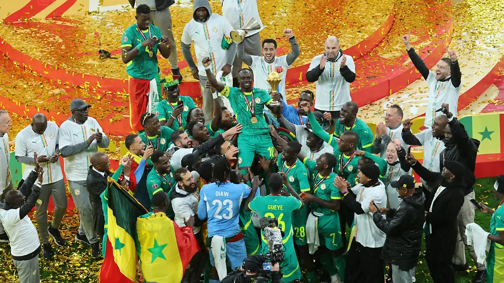 Senegal-s-Sadio-Mane-holds-the-trophy-aloft-as-he-celebrates-with-teammates-after-winning-the-Africa-Cup-of-Nations-final-soccer-match-between-Senegal-and-Morocco-in-Rabat-Morocco-Sunday-Jan-18-2026