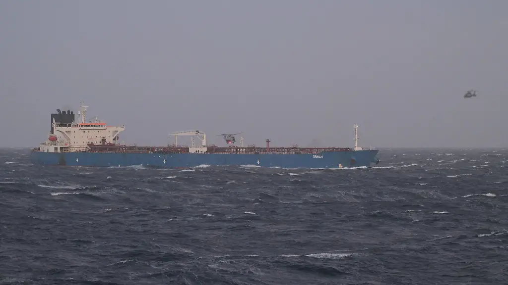 This-handout-photograph-released-by-the-French-Defense-Staff-on-January-22-2026-shows-a-view-of-an-oil-tanker-and-helicopters-and-the-Mediterranean-Sea-The-French-Navy-boarded-an-oil-tanker-from-Russia-in-the-Mediterranean-Sea-suspected-of-belonging-to-the-ghost-fleet-financing-the-war-of-aggression-against-Ukraine-French-President-announced-on-January-22-2026