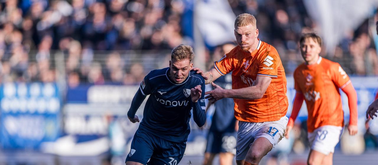 Bochums Leandro Morgalla (l.) im Duell mit Kai Klefisch von Darmstadt 98 | IMAGO / Beautiful Sports Bochums Leandro Morgalla (l.) im Duell mit Kai Klefisch von Darmstadt 98