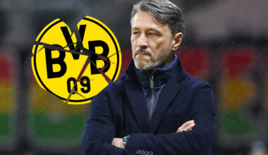Niko Kovac schaut frustriet und mit verschränkten Armen auf ein BVB-Logo.