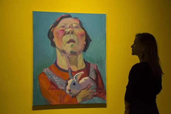 Renate Bertlmann and Maria Lassnig, S2 London Gallery, London, UK London, UK. 25 April 2017. Pictured: A staff member views the painting Untitled (Selbstportrait mit Hase, self-portrait with rabbit), 2003 by Maria Lassnig. SothebyÖs presents two solo exhibitions by Austrian artists Renate Bertlmann and Maria Lassnig at S2 London gallery. Both artists are key figures in the current discussions around the re-evaluation of female artists of the post-war period. The exhibition runs from 27 April to 2 June 2017. S2 is the private sale and gallery arm of Sotheby s Contemporary Art Department.  