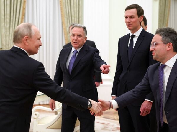 In this pool photograph distributed by the Russian state agency Sputnik, Russia's President Vladimir Putin welcomes US special envoy Steve Witkoff, US President Donald Trump's son-in-law Jared Kushner and Commissioner of the Federal Acquisition Service, FAS, Josh Gruenbaum during a meeting at the Kremlin in Moscow on January 22, 2026. (Photo by Alexander KAZAKOV / POOL / AFP)