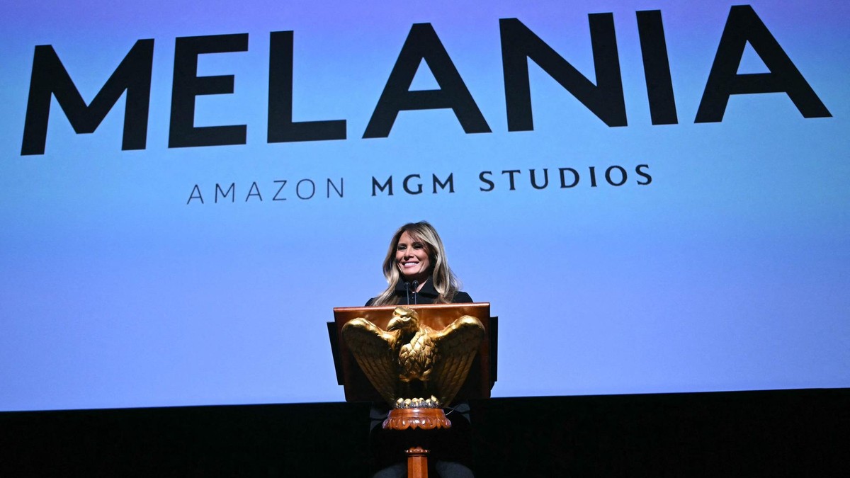 US First Lady Melania Trump speaks during the world premiere of Amazon MGM Studios' "Melania" at the Kennedy Center in Washington, DC, on January 29, 2026. (Photo by Brendan SMIALOWSKI / AFP) US President Donald Trump attends "Melania" premiere
