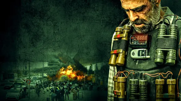 Filmplakat zu "Ultimatum – die Bombe tickt". | © ZDF / Nicolás de Assas. Ein Mann steht in einer Sprengstoffweste mit gesenktem Haupt im Vordergrund