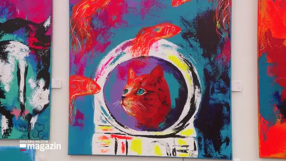 Eine Katze findet sich in einem modernen Gemälde wieder. | Screenshot Eine Katze findet sich in einem modernen Gemälde wieder.