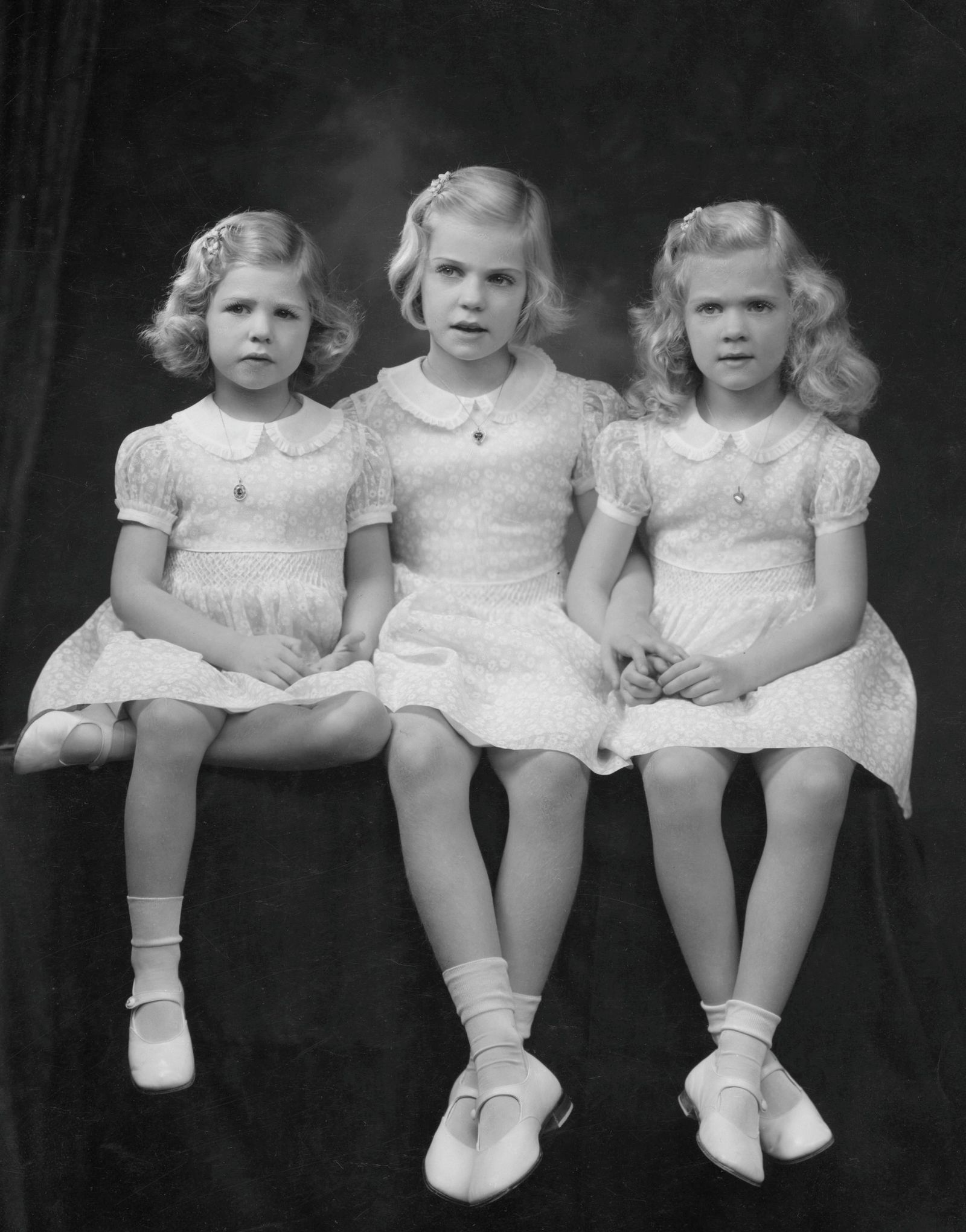 Image may contain Face Head Person Photography Portrait Clothing Dress Child Accessories Jewelry and Necklace