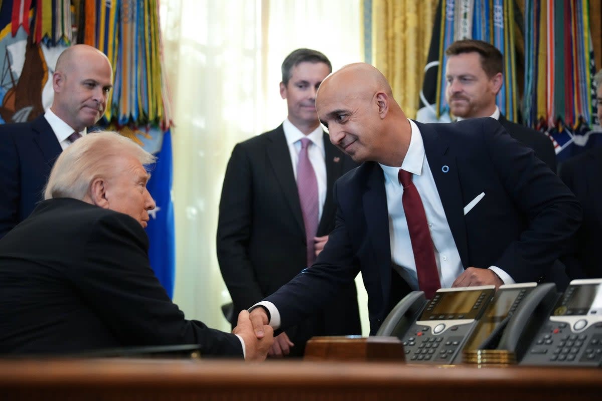 Novo Nordisk CEO Mike Doustdar shakes hands with U.S. President Donald Trump at the White House last November. Doustdar said that partnering with the administration would help expand access to his company’s weight loss drugs (Getty Images)