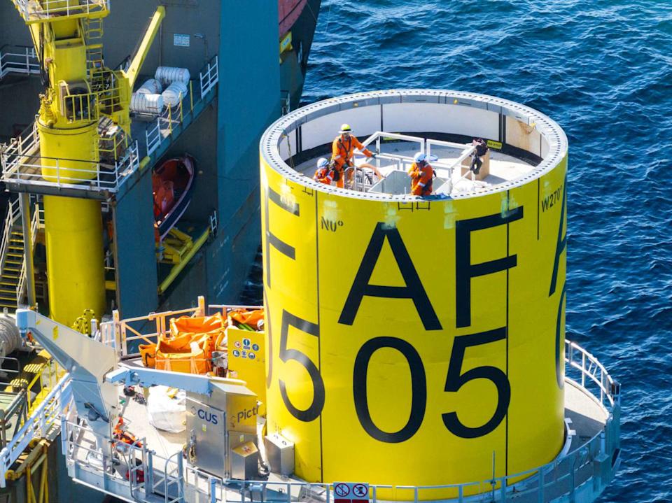 Workers install turbine foundations for Revolution Wind off the coast of Rhode Island. (Credit Orsted/Boskalis)