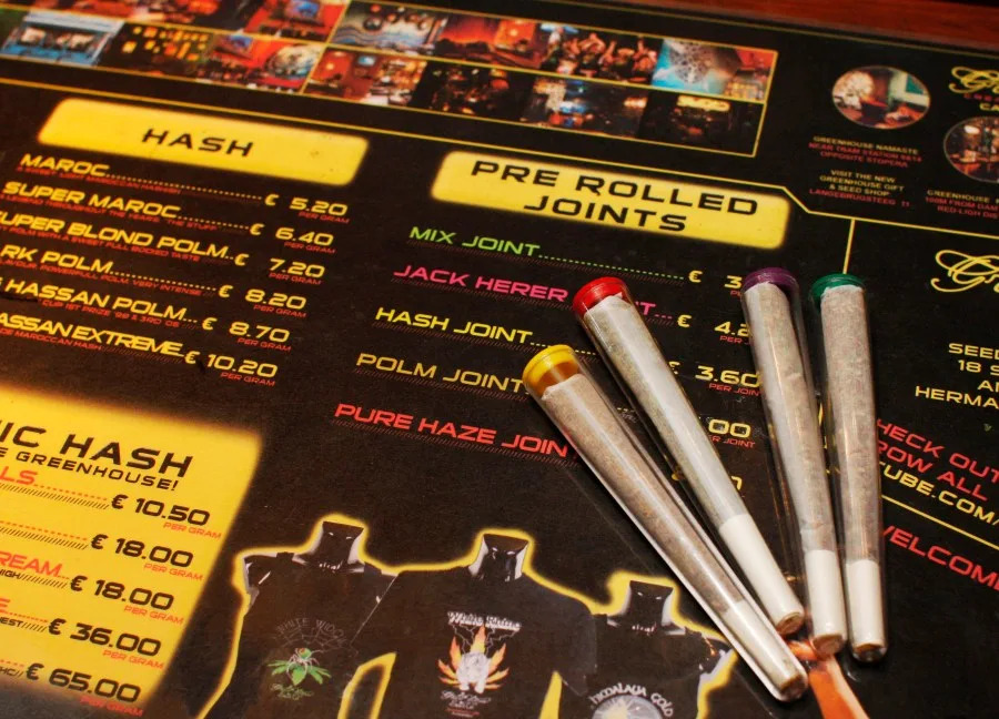 In this June 15, 2008 file image, pre-rolled joints are seen on an english language menu listing the variety of hash and marijuana on sale at The Green House coffee shop in Amsterdam, Netherlands. The Dutch parliament approved controlled growing of marijuana or weed. Dutch lawmakers have voted in favor of tolerating the cultivation of cannabis, in what would be a new expansion of the country’s relaxed pot policy and bring to an end one of its paradoxes. (AP Photo/Peter Dejong)