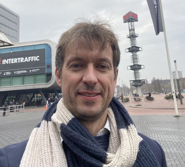 Man in scarf outside RAI