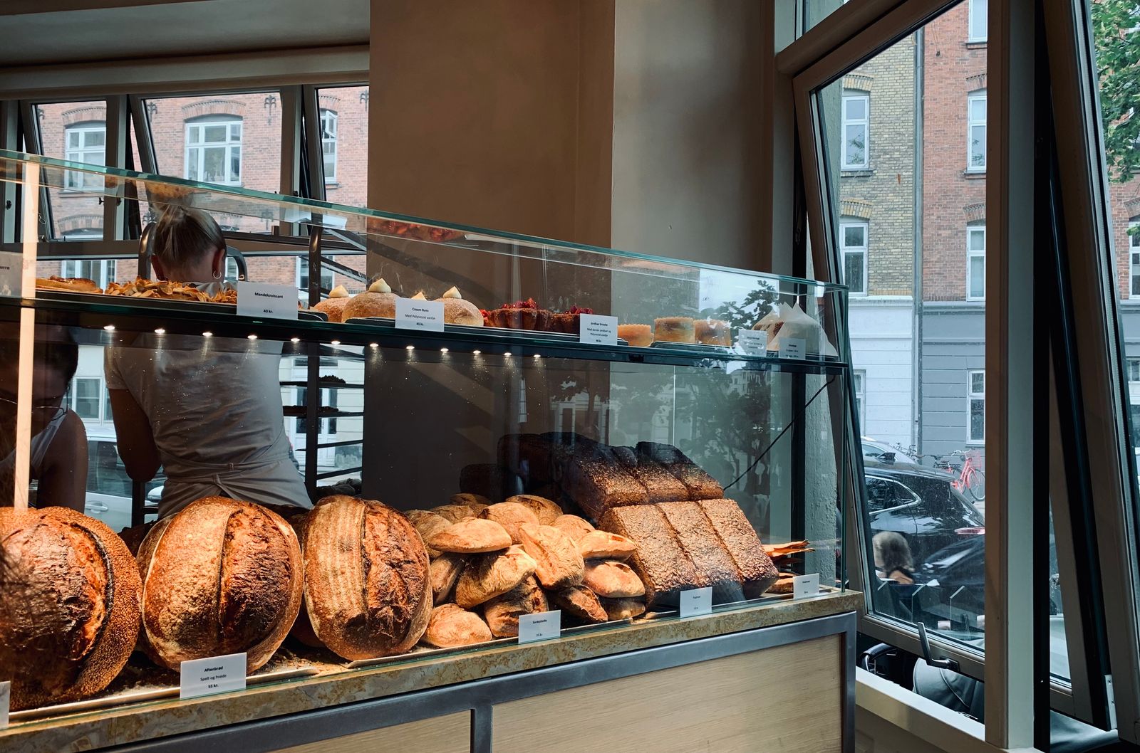 Image may contain Shop Adult Person Bread Food Bakery and Burger