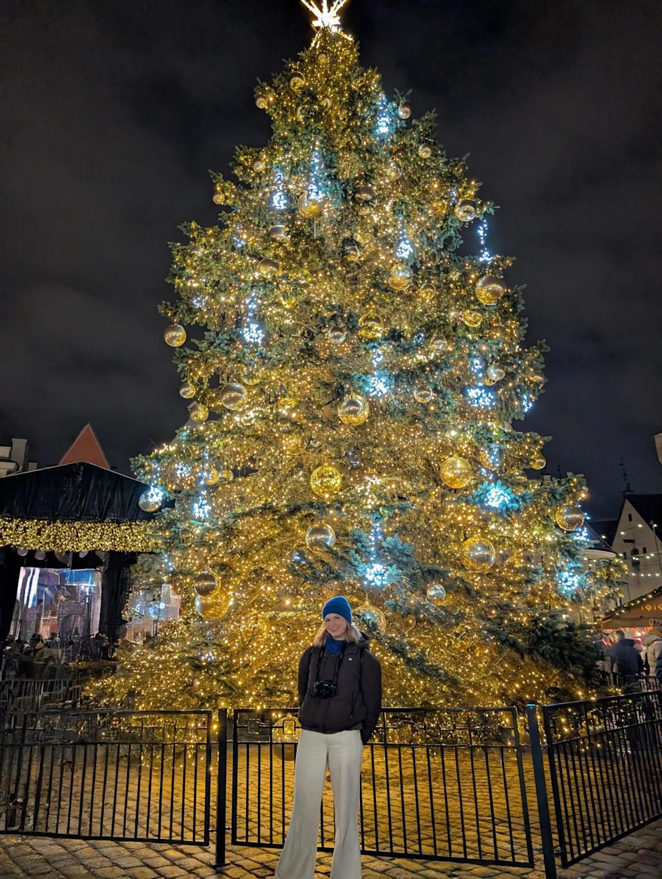 Rachael stands in front of the Christmas tree which has stood in Tallinn's Town Hall Square since 1441