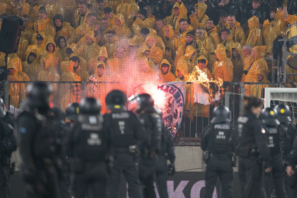 Police chase fans off the field in clashes at German club game in Dresden