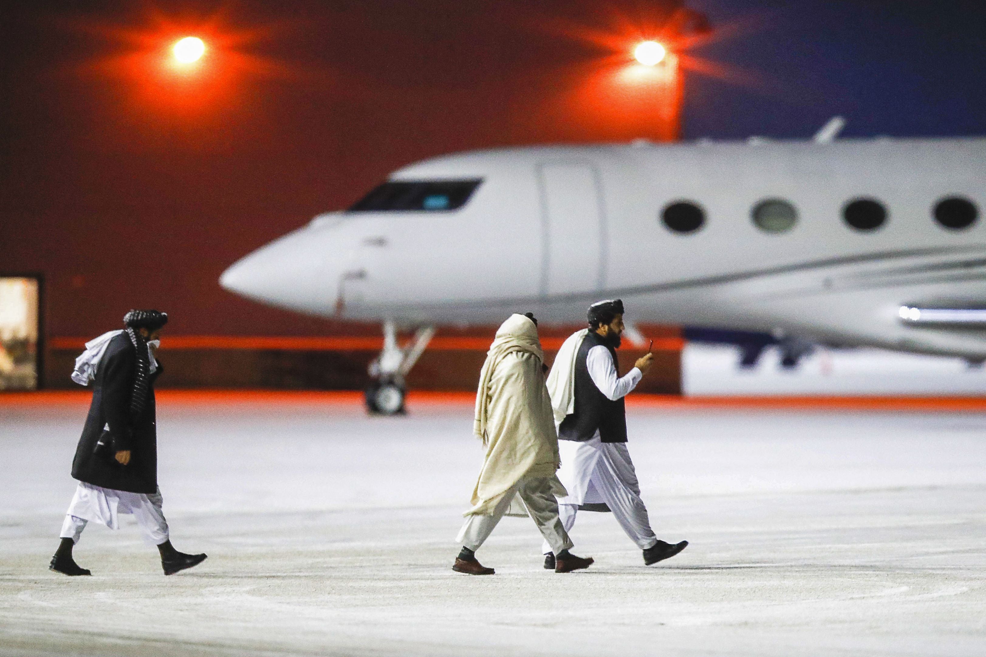 Representatives of the Taliban leave Gardermoen airport after attending meetings with international officials and humanitarian organisations at the Soria Moria hotel in Oslo