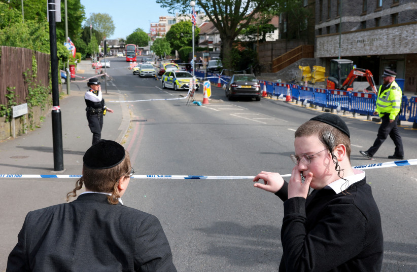 Orthodox Jews stand by a police cordon, after a man was arrested following a stabbing incident in the Golders Green area, which is home to a large Jewish population, in London, Britain, April 29, 2026.