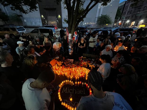 Friends and neighbors attend a memorial for the crash victims on Amsterdam Ave. near West 109th St. on Sunday.