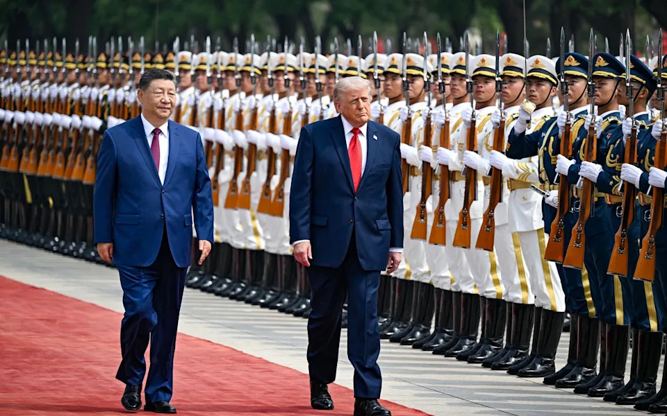 Mr Trump and Xi Jinping during a US state visit to Bejing on May 14