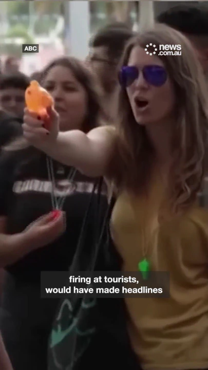 Furious Spanish protesters spray tourists with water pistols
