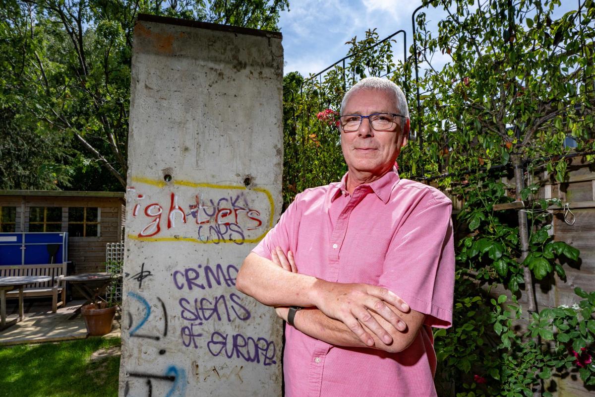 Neighbours divided as a slice of the Berlin Wall appears in a garden in London