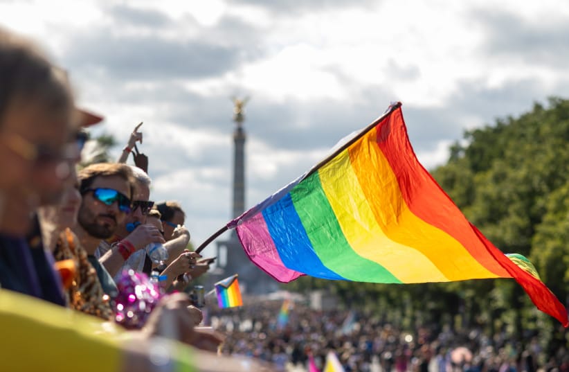 Participants dance during the 2025 Christopher Street Day CSD Berlin Pride march at Strasse des 17. Juni street between the Brandenburg Gate and Victory Column in Berlin, Germany, July 26, 2025.