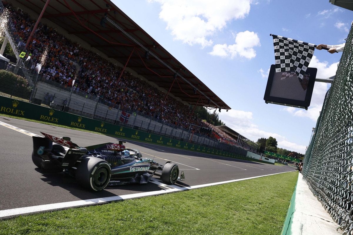 Mercedes driver George Russell of Britain receives the checkered flag as he crosses the finish line to win the Formula One Grand Prix at the Spa-Francorchamps racetrack in Spa, Belgium, Sunday, July 28, 2024. (Simon Wohlfahrt, Pool Photo via AP). EDITORIAL USE ONLY/ONLY ITALY AND SPAIN